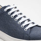 Close-up of the Vegan Hemp Sneaker V1 showcasing its blue hemp fabric and white laces.