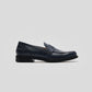 Vegan Loafer - Man, stylish navy shoe featuring blake construction and U-shaped stitched pattern.