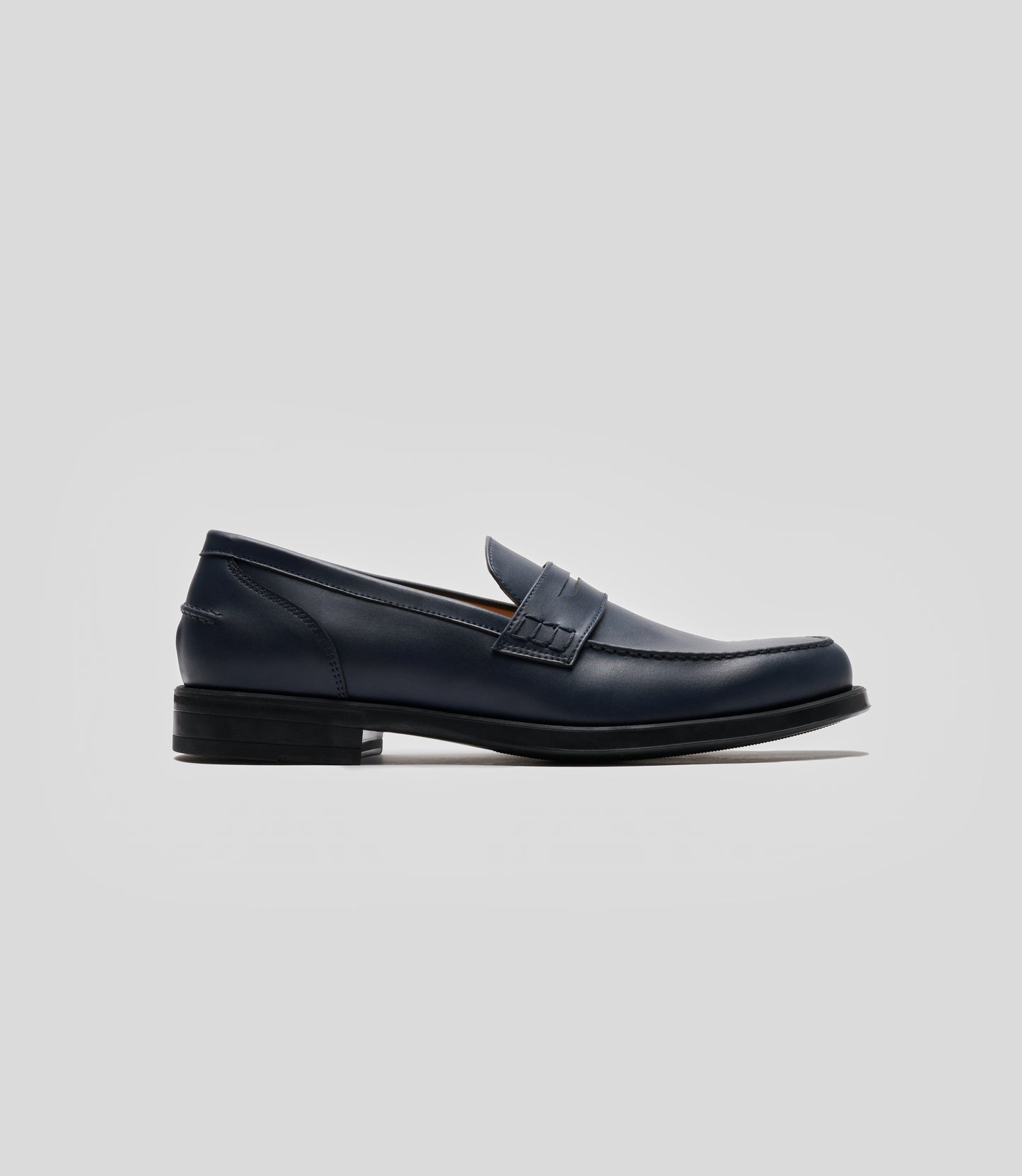 Vegan Loafer - Man, stylish navy shoe featuring blake construction and U-shaped stitched pattern.