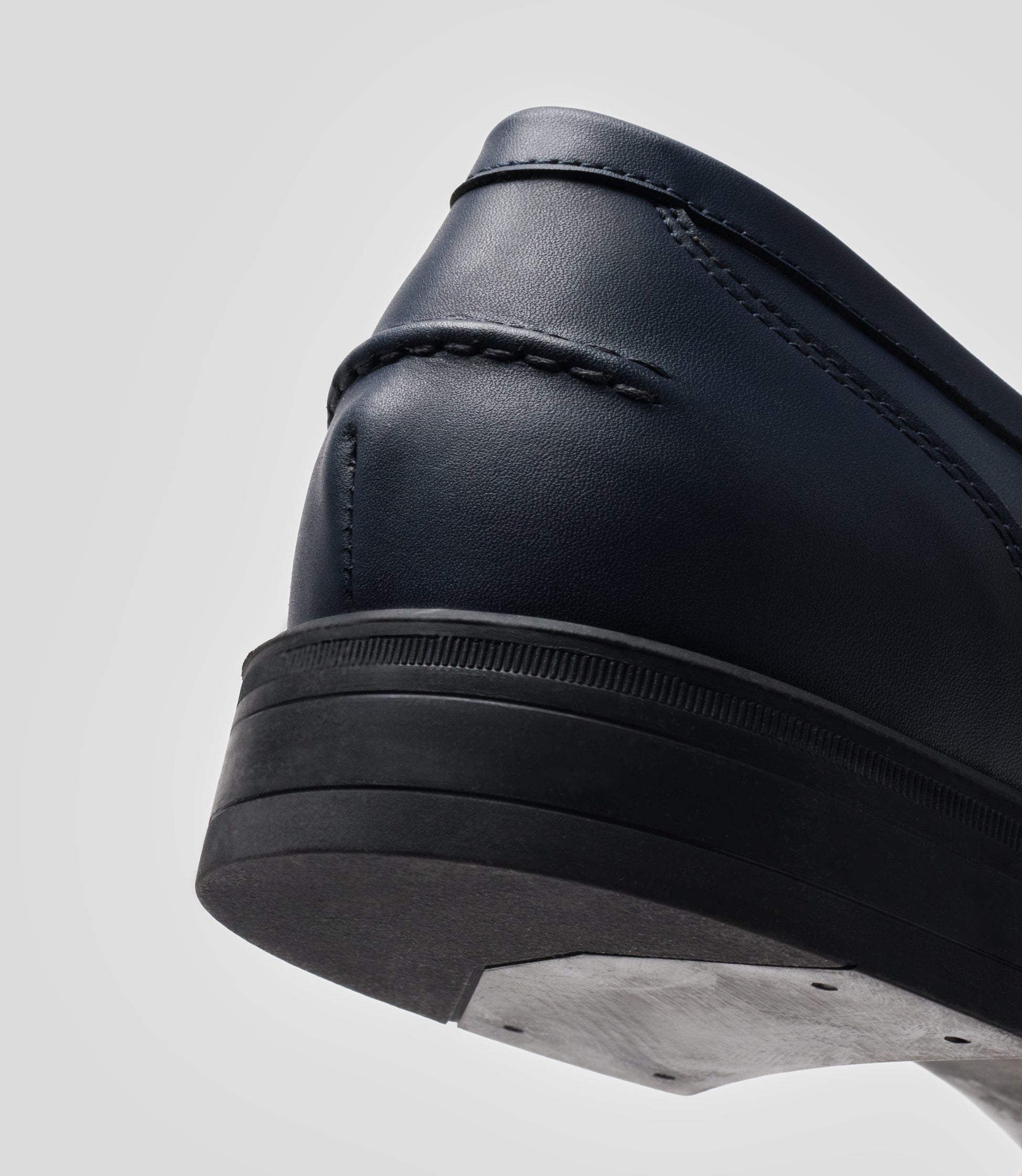 Vegan Loafer - Man showcasing the rear view with unique stitching and black sole.