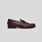Vegan Loafer - Man in burgundy color with a distinctive U-shaped pattern and sleek design.