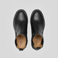 Vegan Chelsea boots - Woman viewed from above, showcasing their sleek black design and elegant style.