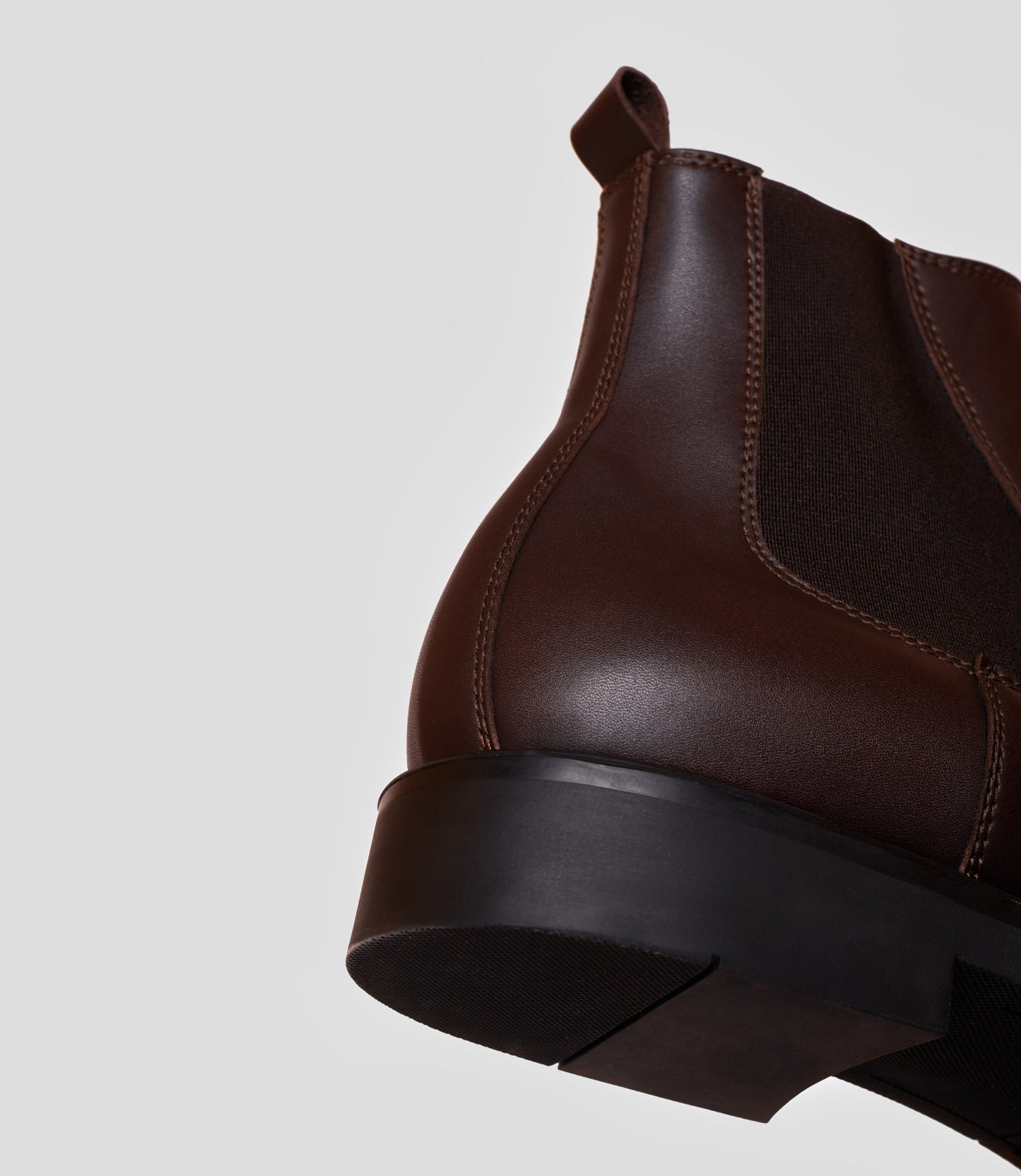 Vegan Chelsea Boot - Men featuring handstitched design and sleek brown leather with a sturdy black sole.