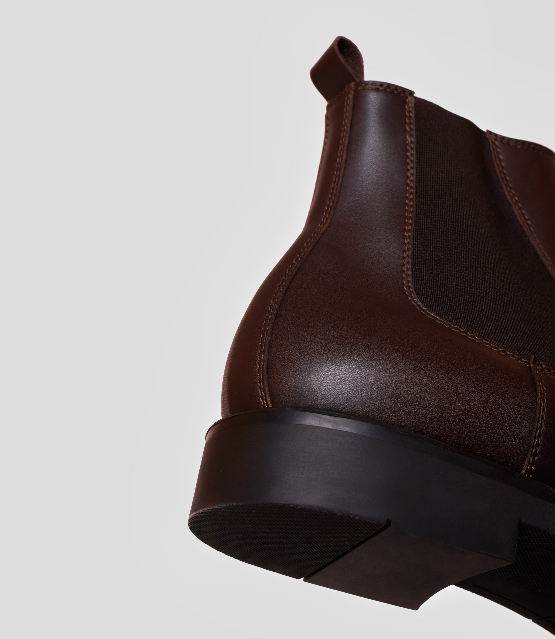 Vegan Chelsea Boot - Men featuring handstitched design and sleek brown leather with a sturdy black sole.