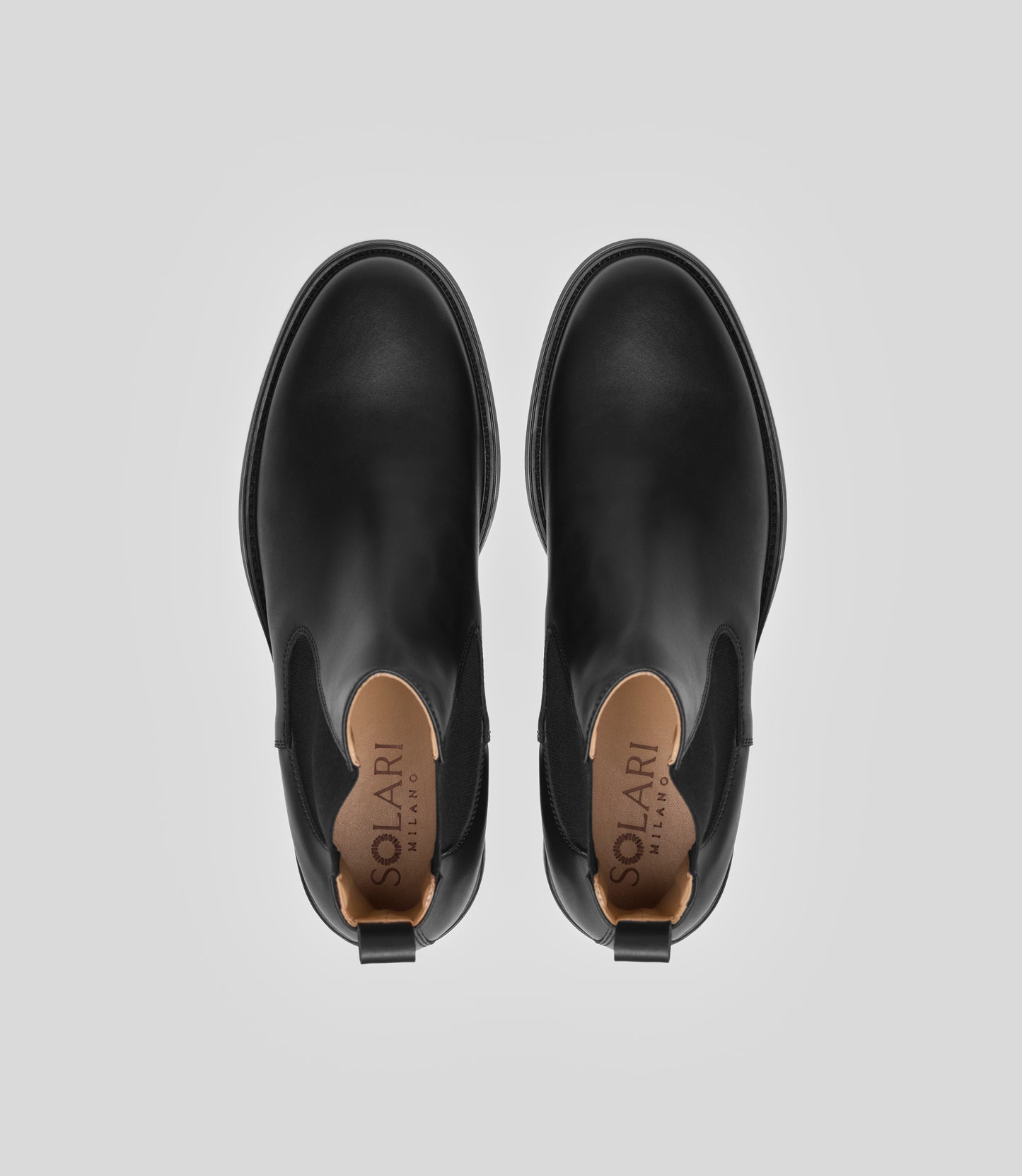 Vegan Chelsea Boot - Men, elegant black boots showing top view with a sleek design and stylish details.