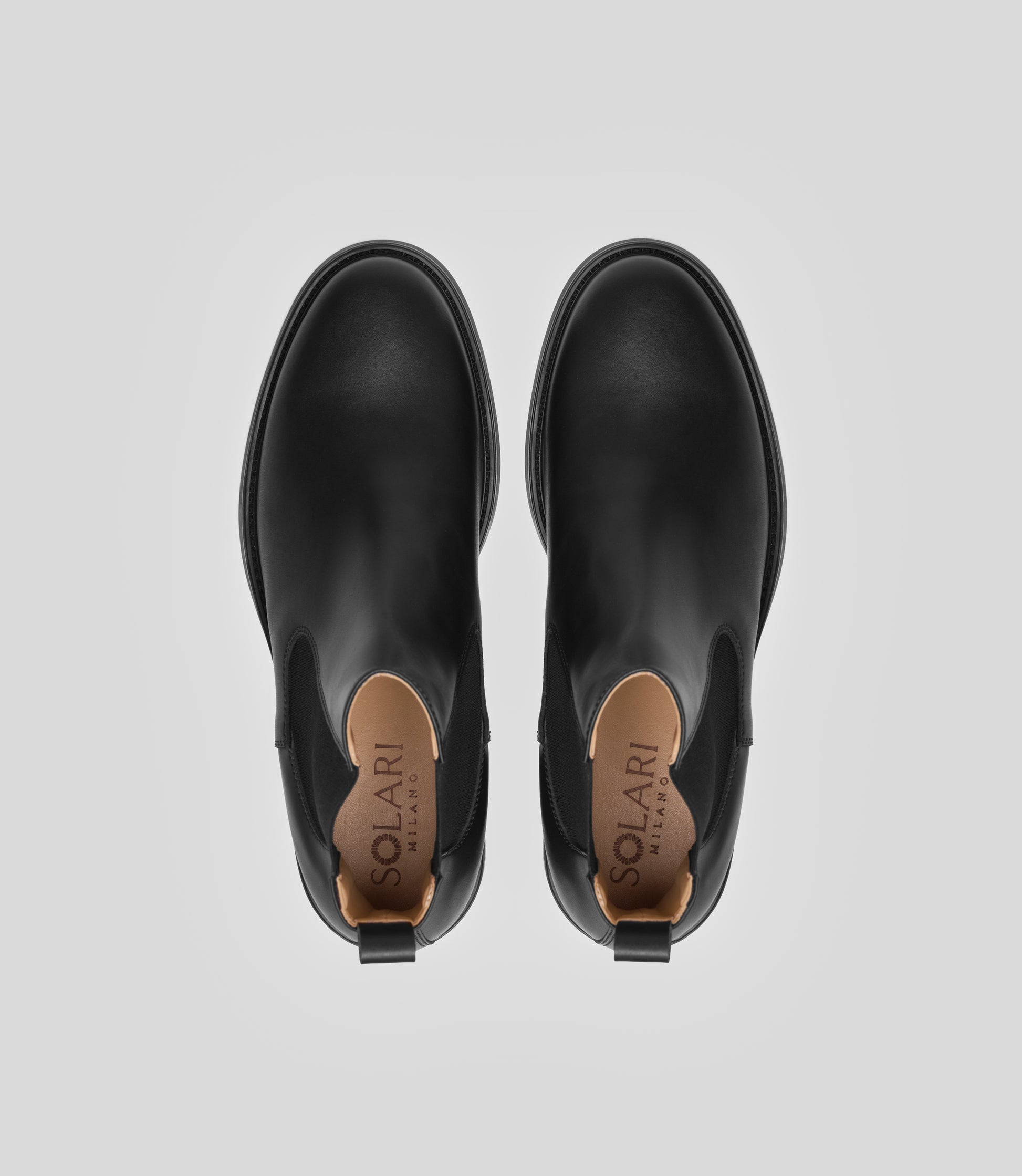 Vegan Chelsea Boot - Men, elegant black boots showing top view with a sleek design and stylish details.