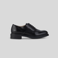 Vegan Derby - Woman black shoe side view showcasing Blake Construction detail.