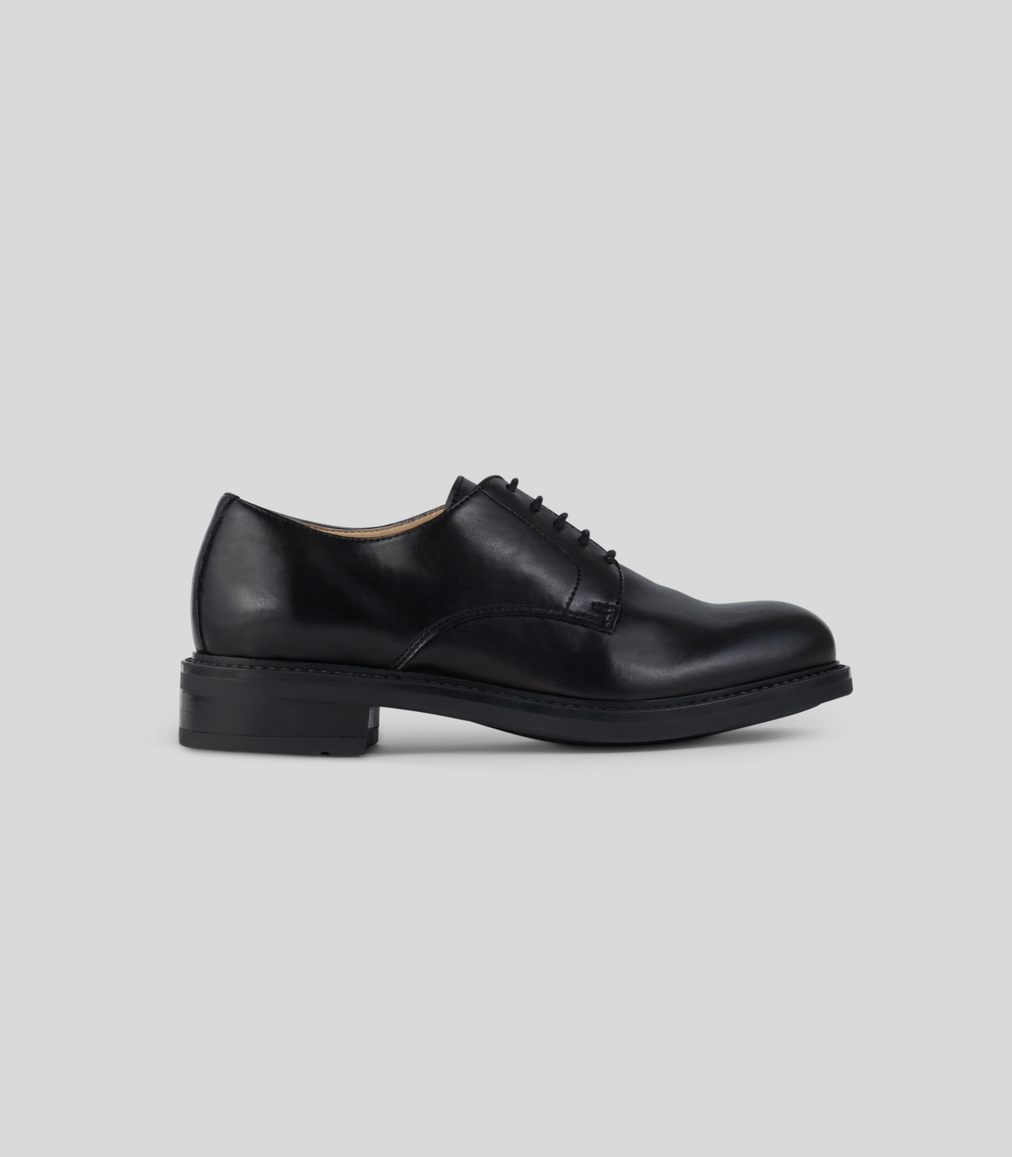 Vegan Derby - Woman black shoe side view showcasing Blake Construction detail.