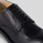 Vegan Derby - Woman black shoe with open lacing system and Blake Construction detail.