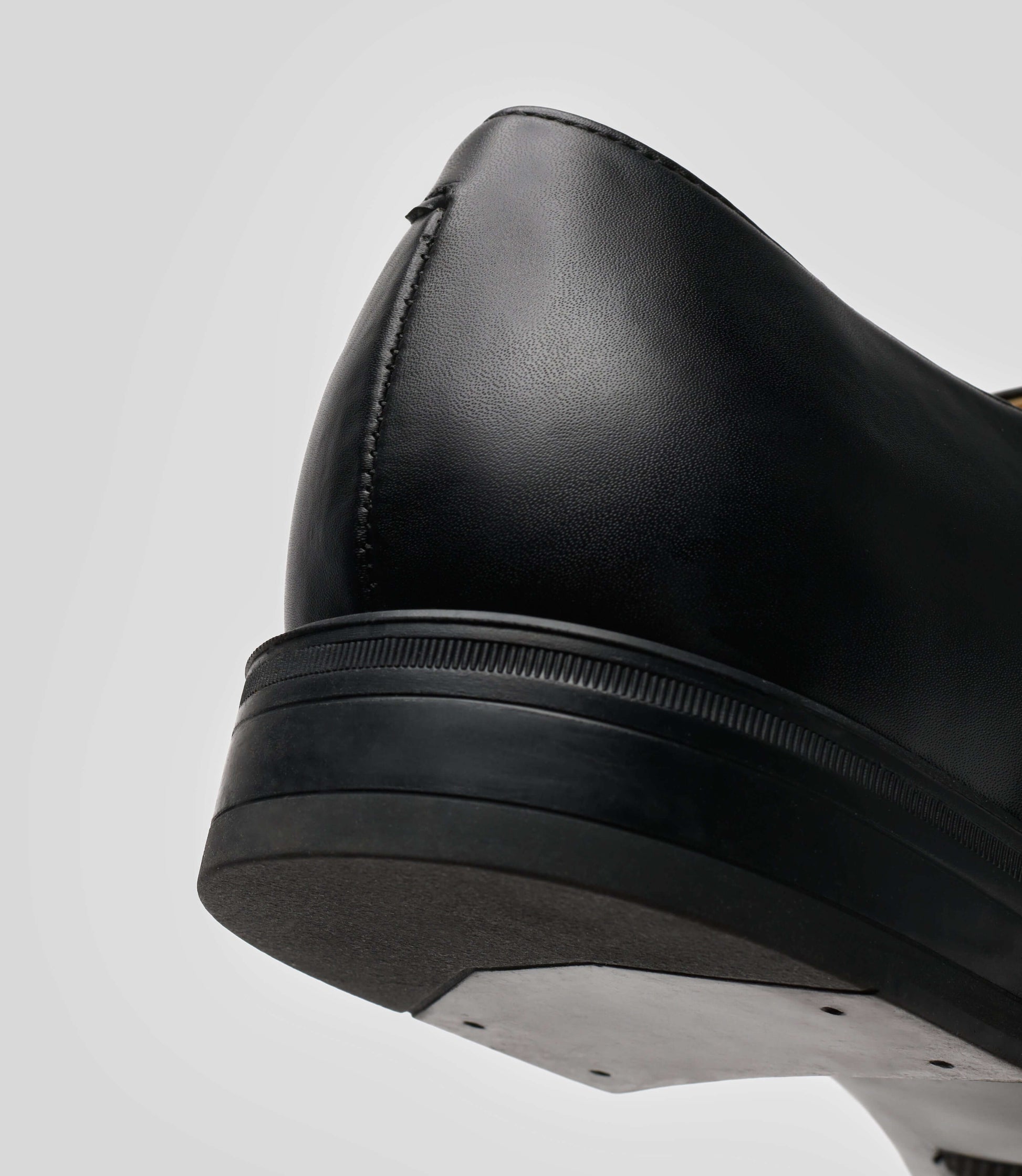 Close-up of the Vegan Monk Strap - Man shoe showcasing the back silhouette and black leather details.
